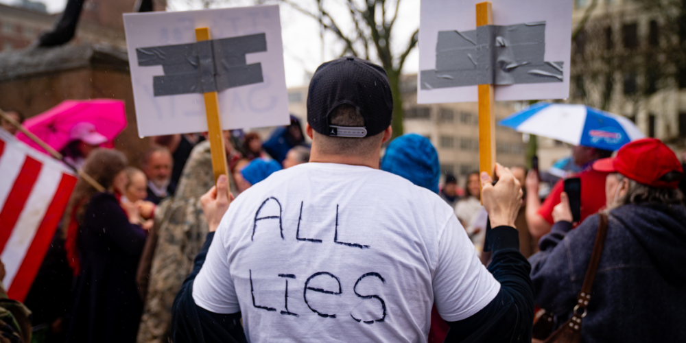 A man at a right-wing protest against COVID policies in Albany, New York. 