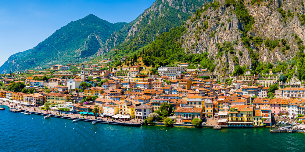 Italy’s Lake Garda, surrounded by turquoise water and dramatic cliffs.
