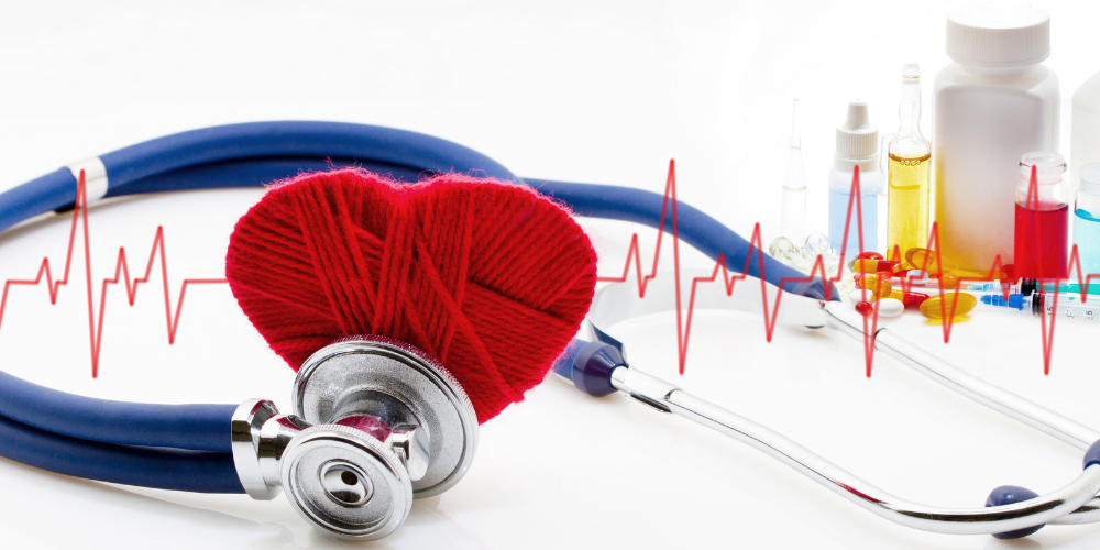 Stethoscope and red heart on a white background.